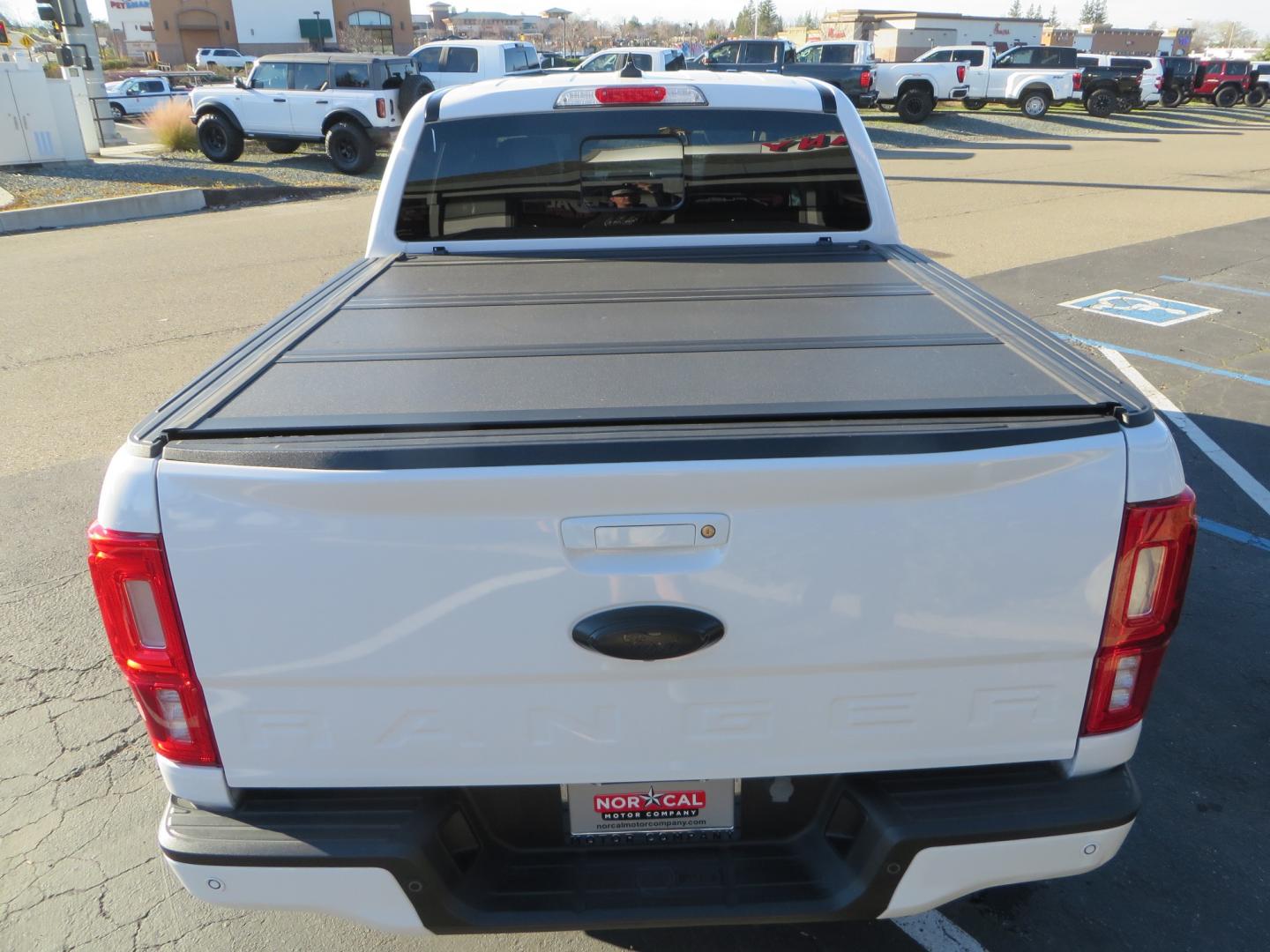 2019 White /Black Ford Ranger Lariat (1FTER4FHXKL) with an 2.3L engine, automatic transmission, located at 2630 Grass Valley Highway, Auburn, CA, 95603, (530) 508-5100, 38.937893, -121.095482 - Features a Fabtech suspension system, Fuel Offroad wheels, Nitto Ridge Grappler tires, Westin Running boards, and a Bakflip. - Photo#10